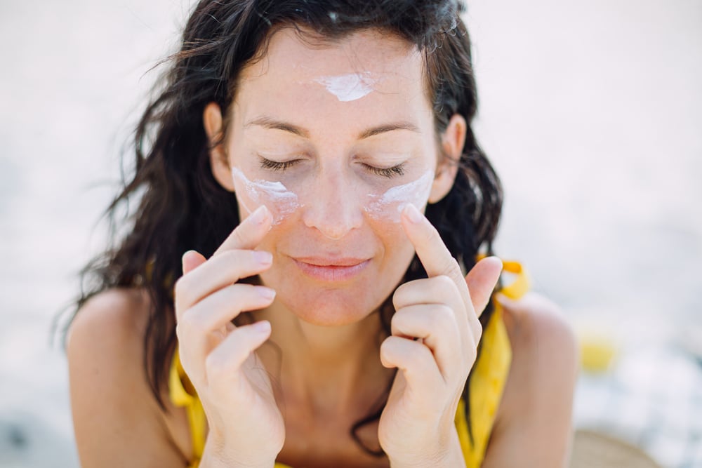 Woman with sunscreen on her face