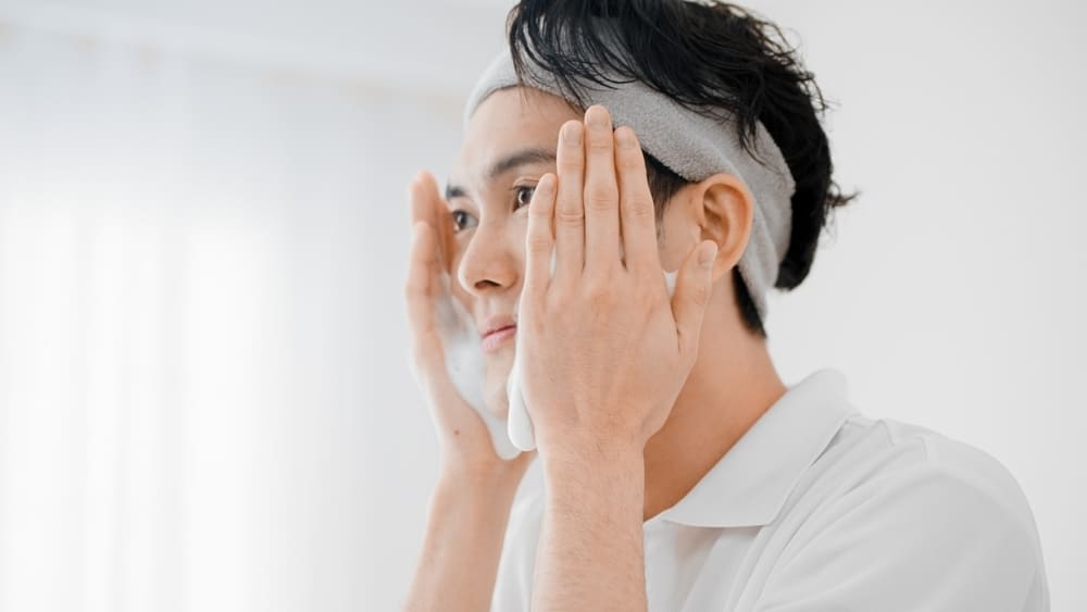 Young man washing his face Beauty Image 